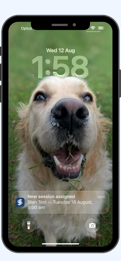 iPhone lock screen showing a Simplo NDIS Teams push notification: New session assigned for Stan Test on Tuesday 18 August at 9am
